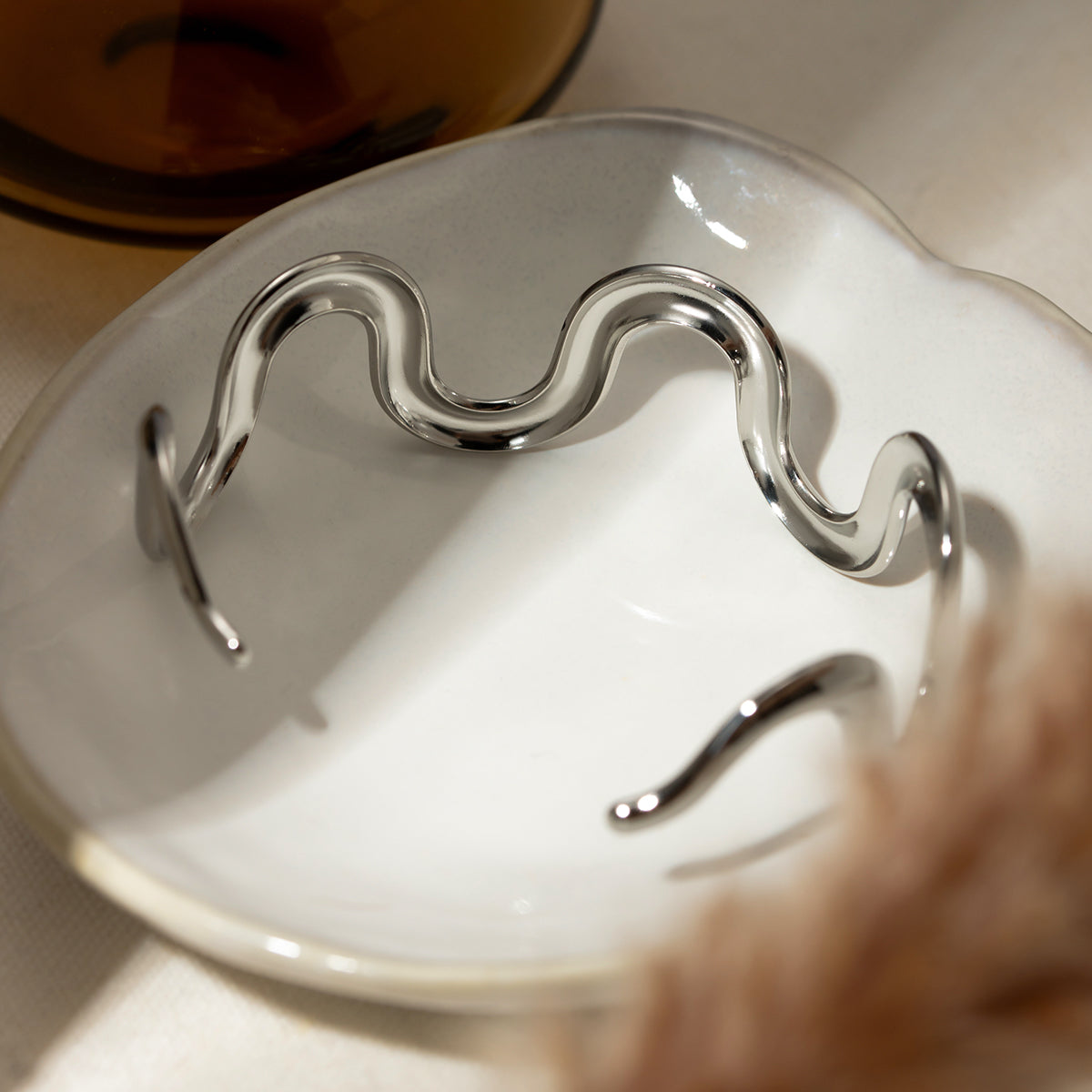 High polish stainless steel sculpted wave cuff bracelet with minimalist open design