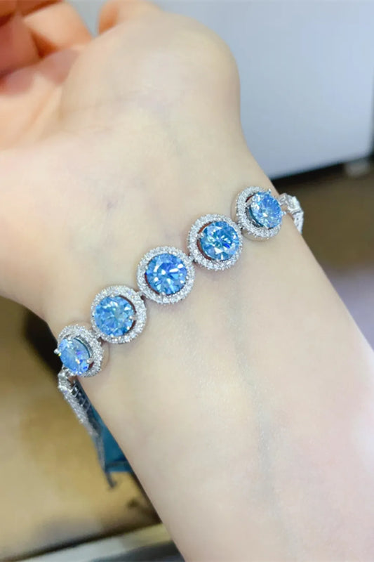 5 carat moissanite tennis bracelet in platinum plated sterling silver worn on wrist