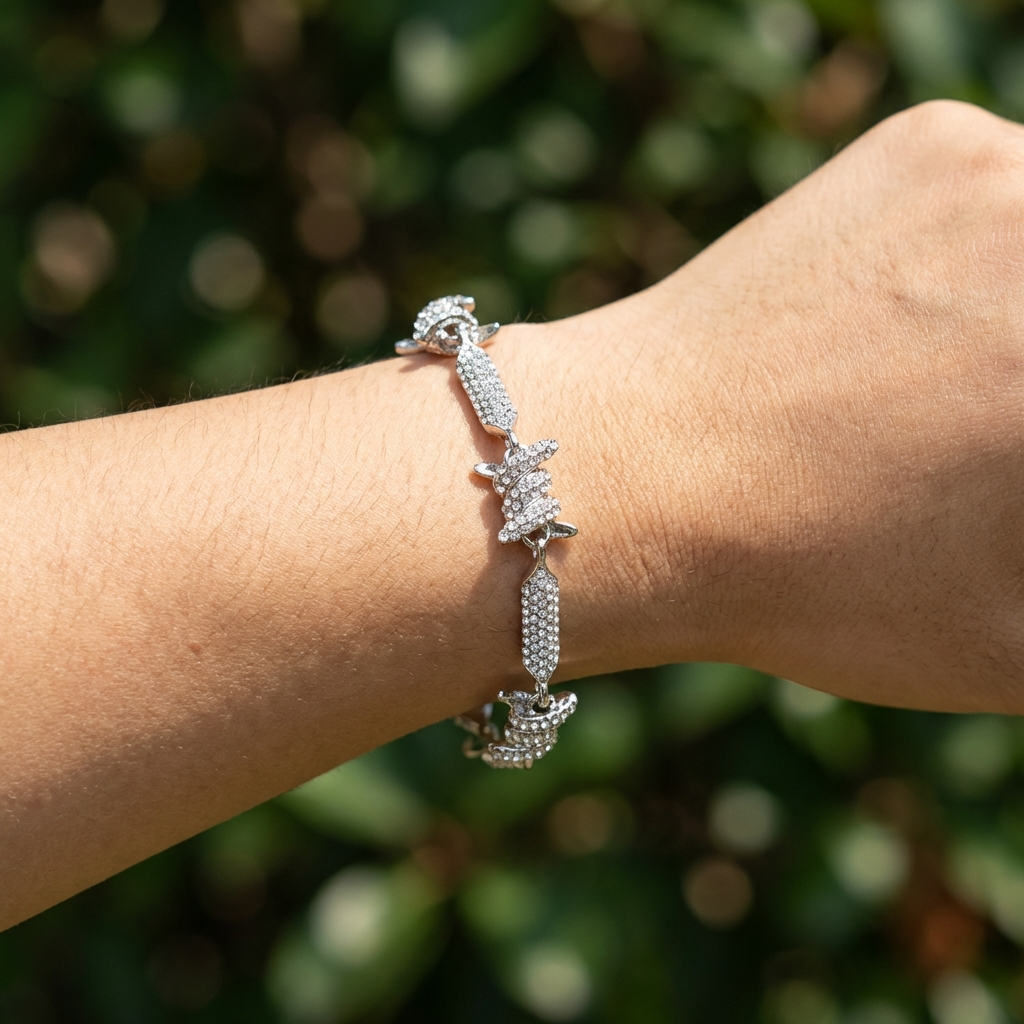 A woman's arm wearing the Virelli pavé barbed link bracelet silver luxury statement bracelet by MerchLuxx