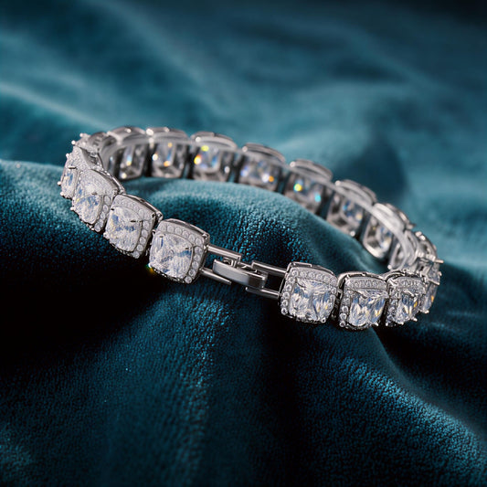 Valmeri pavé radiance link bracelet, white gold tone, luxury bracelet by MerchLuxx on a teal fabric background