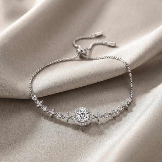 1 carat minimalist moissanite bracelet in sterling silver with center stone detail on a beige fabric background