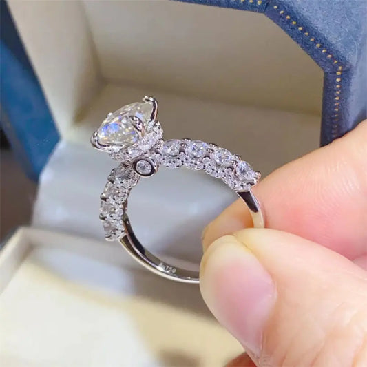 Close-up of Valeriqueâ„¢ 2-carat moissanite side stone ring