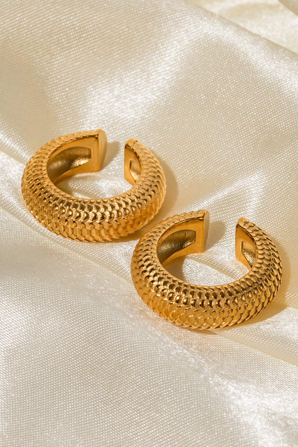 Textured gold and platinum-tone stainless steel cuff earrings
