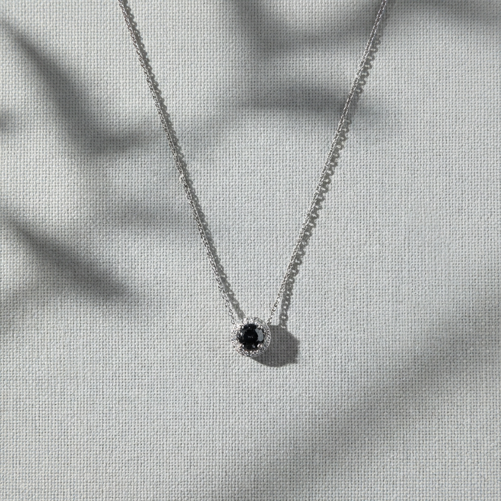 Noctéra 1 carat two-tone moissanite halo pendant necklace in platinum-plated sterling silver by MerchLuxx on a light gray background