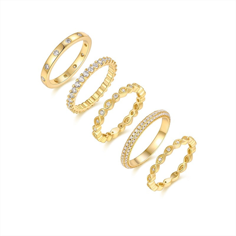 Set of  Aurielle moissanite stackable ring set in 18K gold-plated sterling silver layered luxury bands by MerchLuxx  on a white background