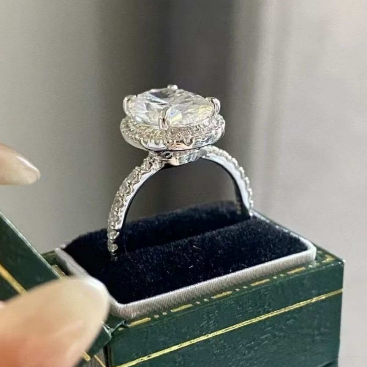 Avelisse 2 carat oval moissanite ring side angle showing elevated setting