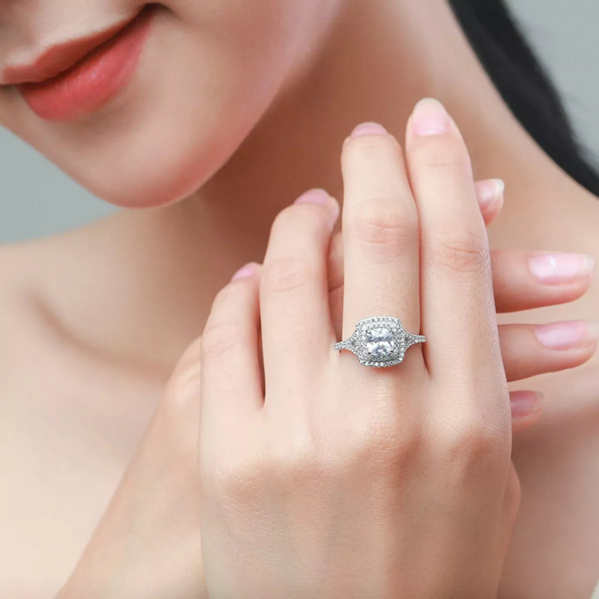 Woman wearing the Virella™ Radiant Halo Ring