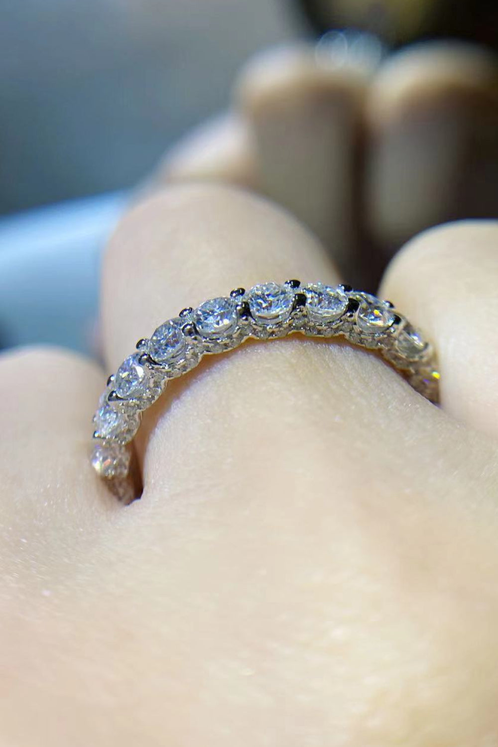 Eternyx™ Moissanite Eternity Ring worn on a finger