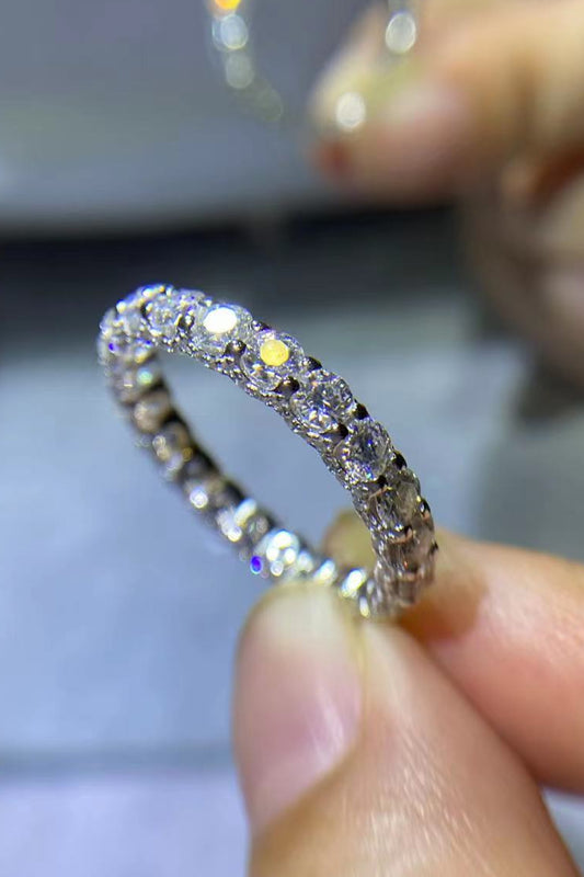 Close-up of the Eternyx Classic Eternity Ring held between fingers