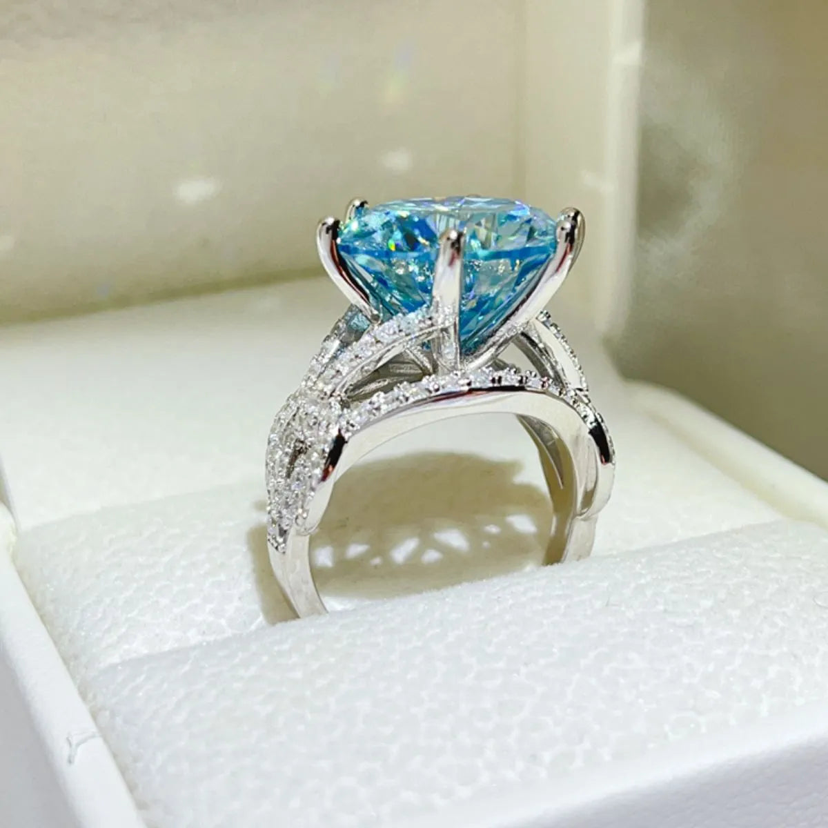 Azuréa 10 carat blue moissanite ring, side view showing sterling silver setting