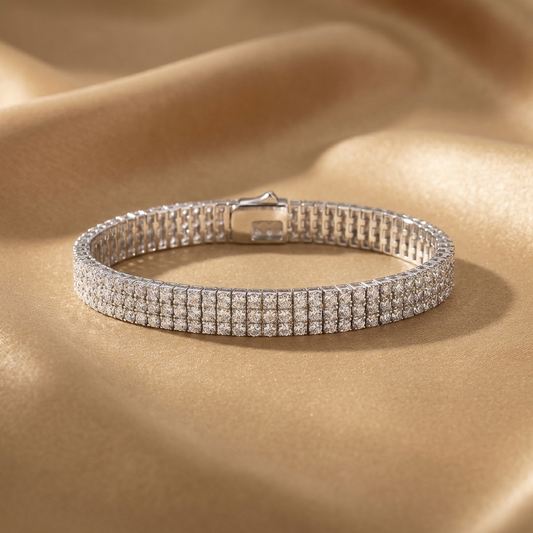 Imperielle multi-row moissanite tennis bracelet in S925 sterling silver, wide statement wrist jewelry by MerchLuxx on a beige fabric background