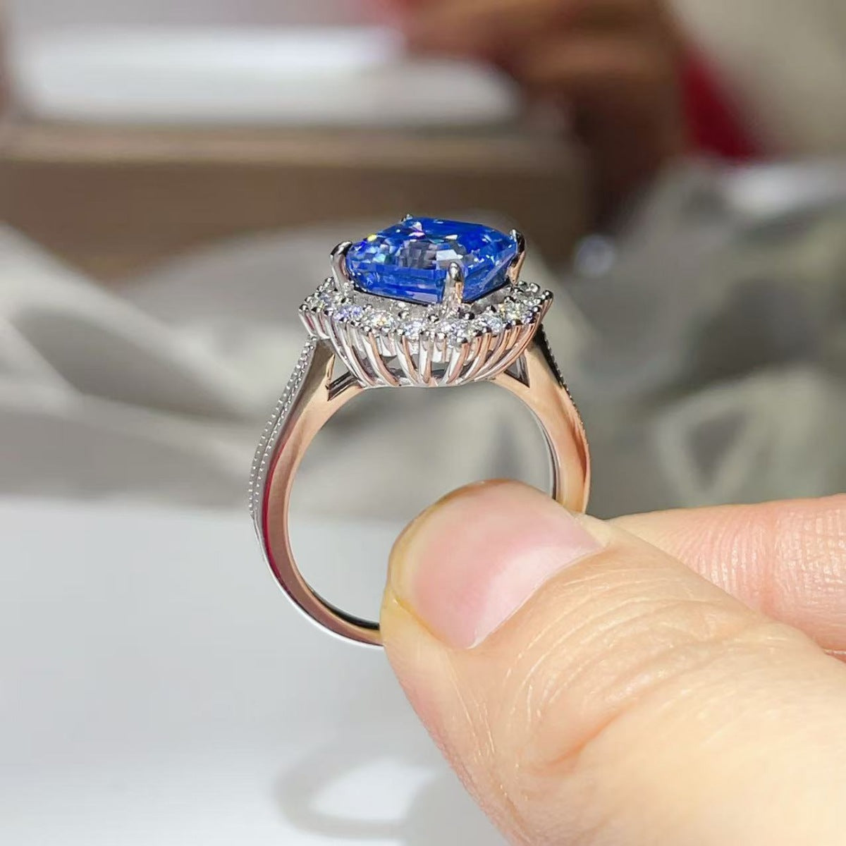 Side profile of the Sapphire™ Blue Halo Ring showing the halo setting and band