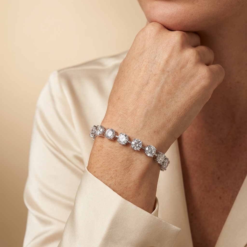 Close-up of a person a Tempéra moissanite tennis bracelet in S925 sterling silver with round brilliant stones, luxury jewelry by MerchLuxx on a beige background