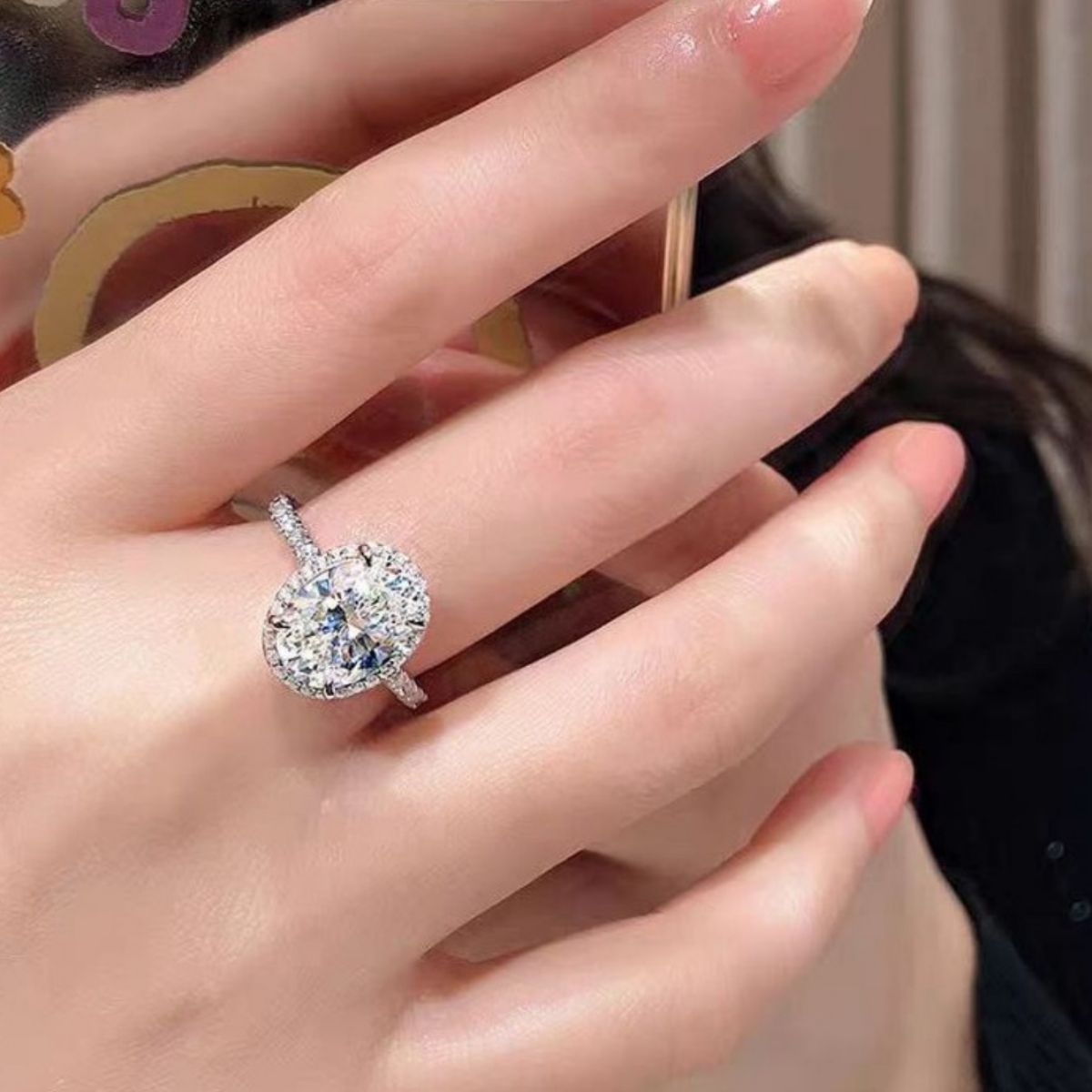 Avelisse oval moissanite ring worn on hand
