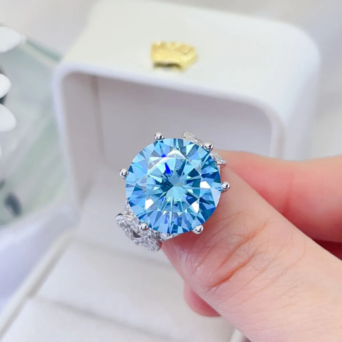 Azuréa blue moissanite ring top view showing brilliant round center stone