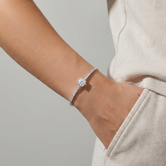 Écloria 1 carat moissanite tennis bracelet in S925 sterling silver, delicate luxury wrist jewelry by MerchLuxxon on a wrist against a neutral background