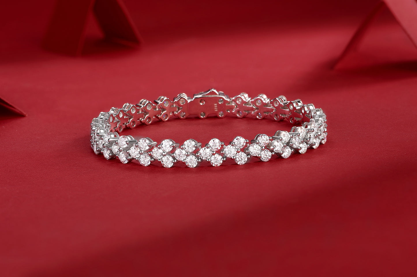 Luminara moissanite cluster tennis bracelet in S925 sterling silver luxury wrist jewelry by MerchLuxx on a red background