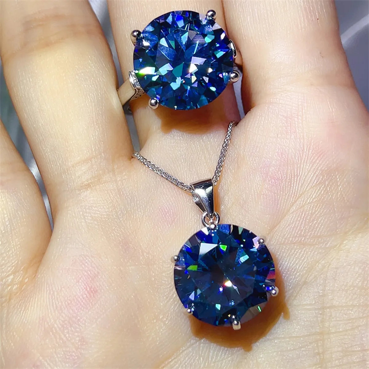 Astrielle 10-carat blue moissanite ring and pendant necklace set in sterling silver by MerchLuxx