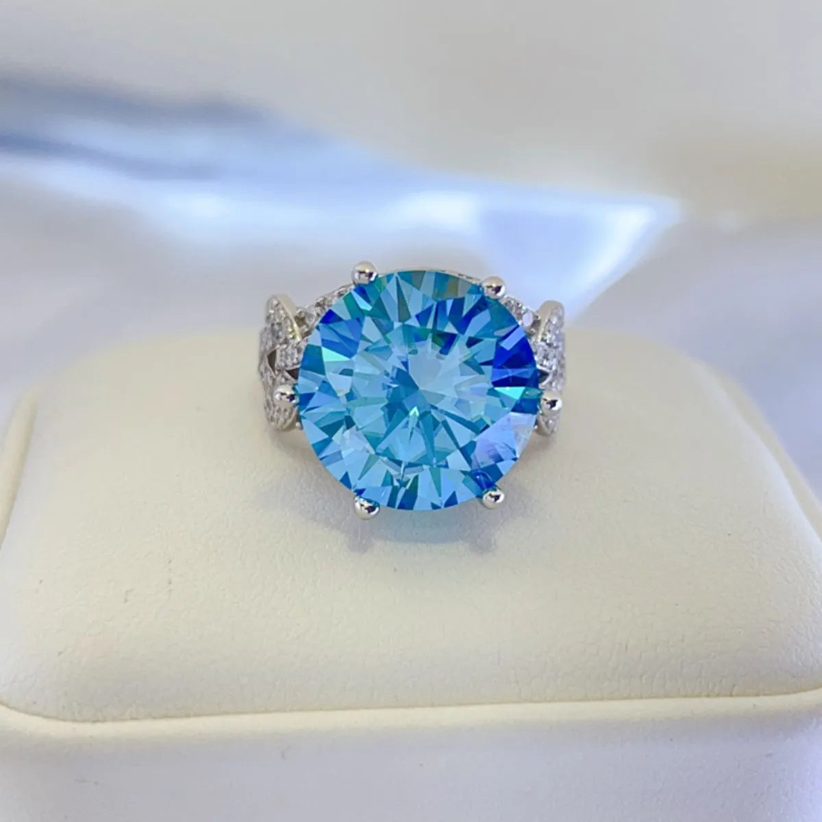 10 carat blue moissanite statement ring displayed in jewelry box