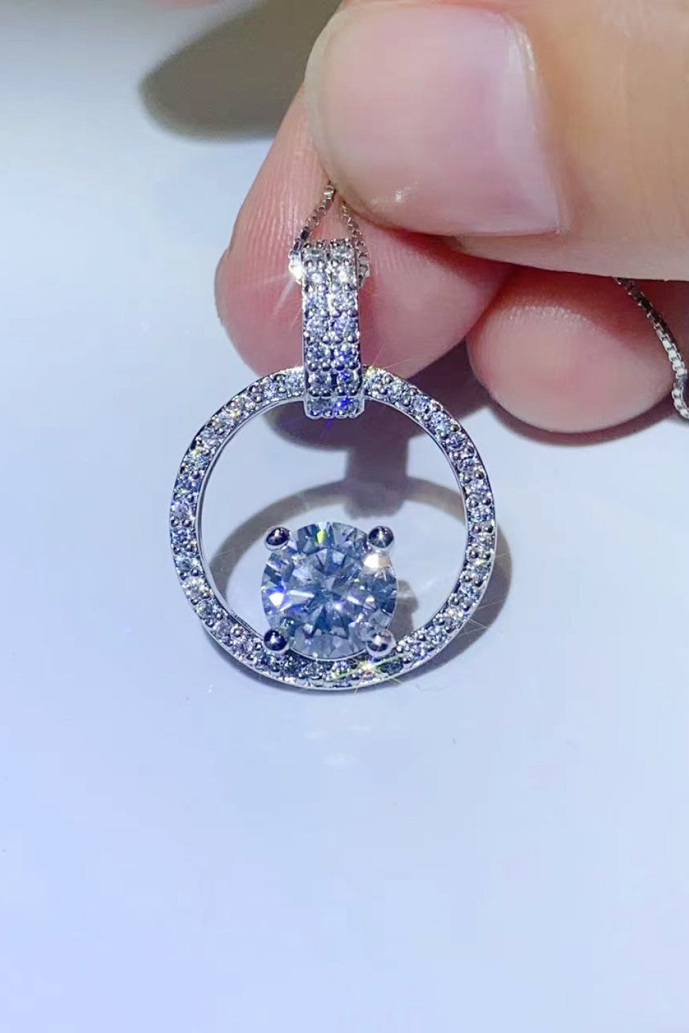 1 carat dancing moissanite circle necklace in platinum plated sterling silver
