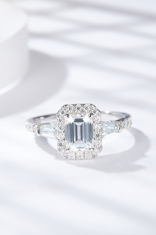Virella emerald-cut moissanite halo ring in platinum-plated sterling silver by MerchLuxx