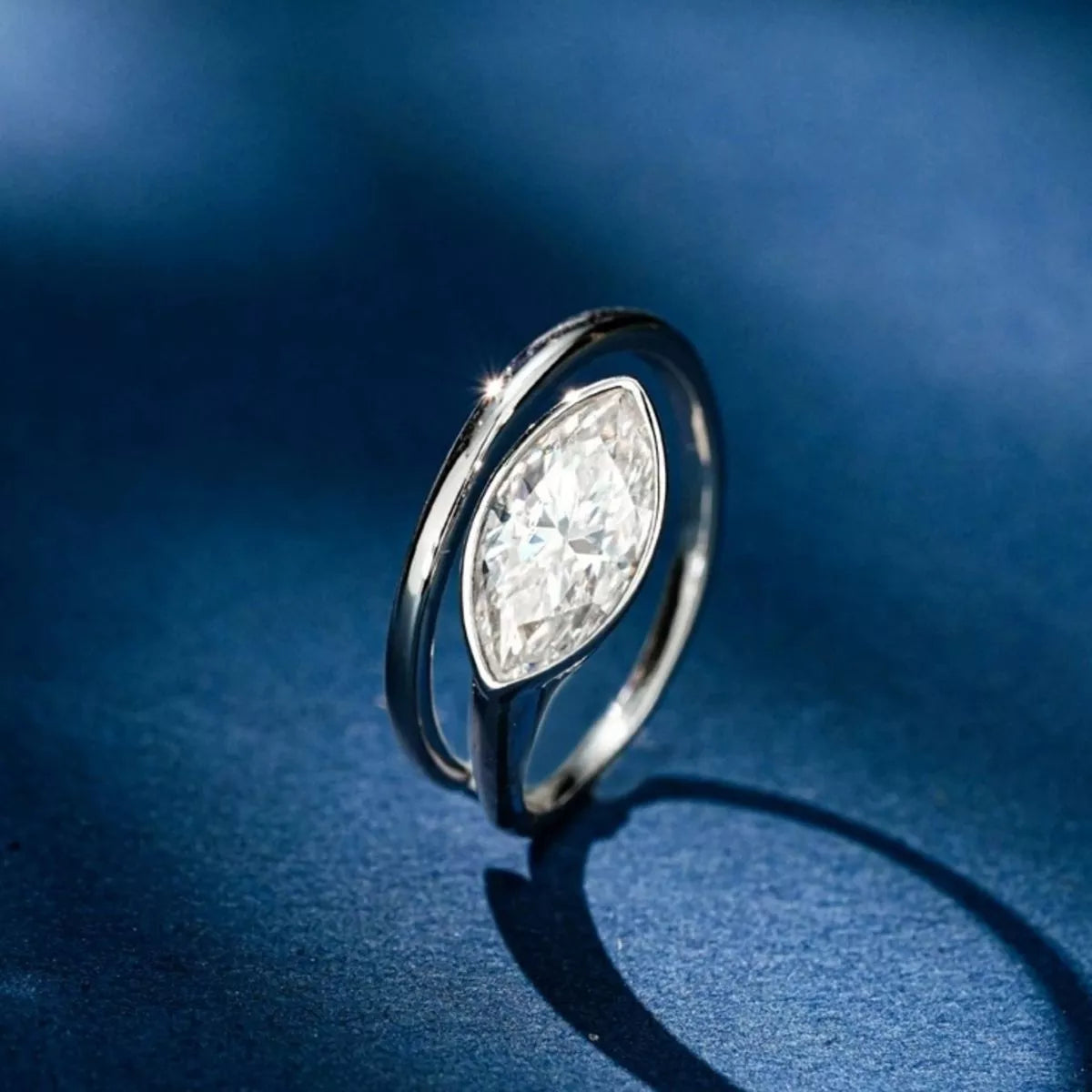Side profile of Lunara™ marquise-cut moissanite bypass ring