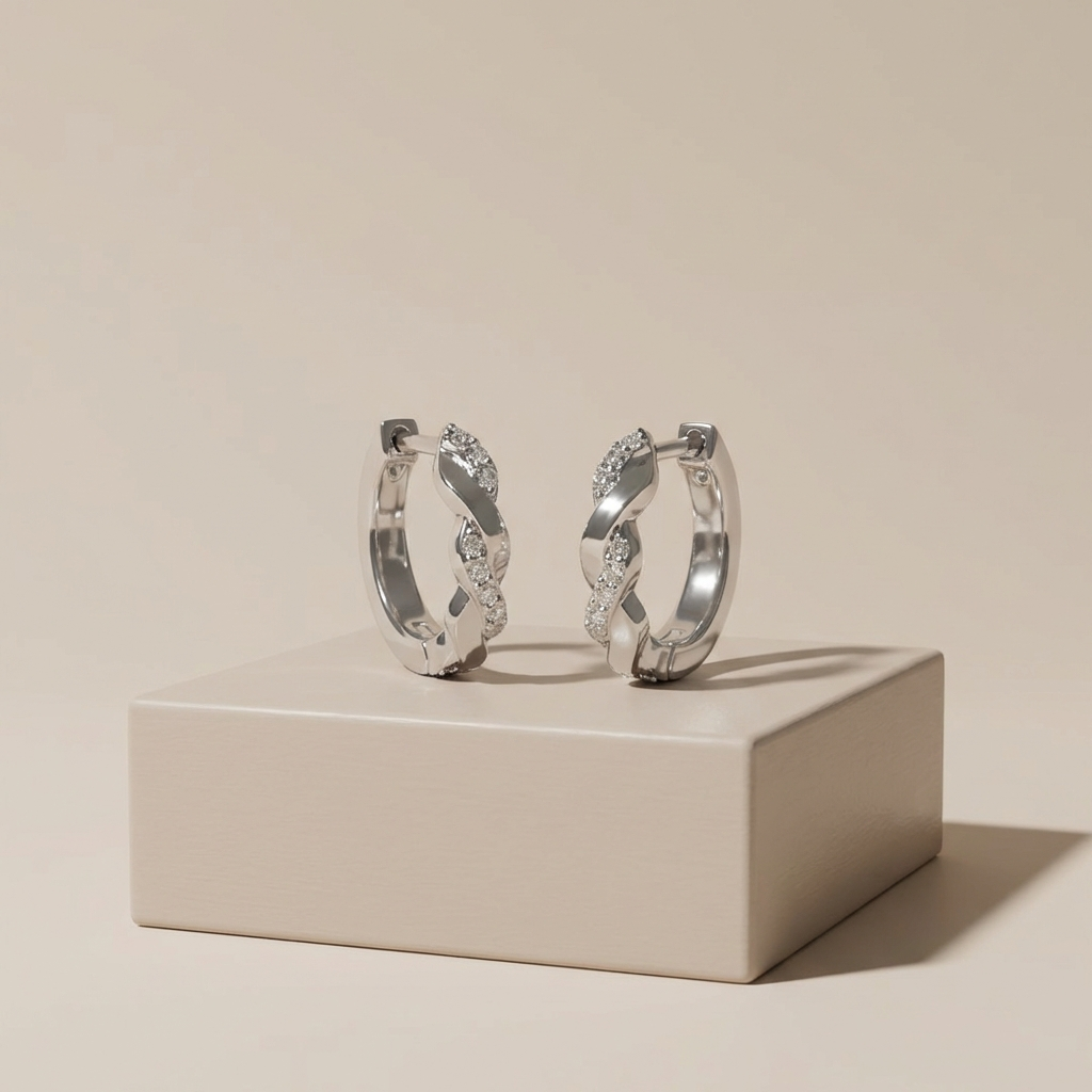 Platinum-plated sterling silver twisted channel set moissanite hoop earrings by MerchLuxx