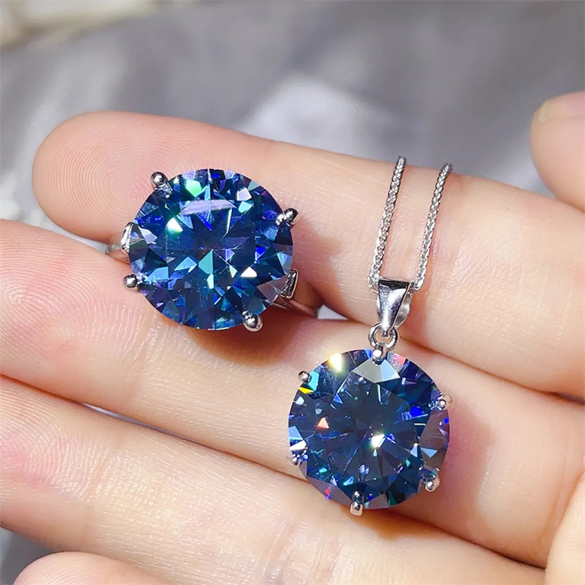 Astrielle 10-carat blue moissanite ring and pendant necklace set in sterling silver by MerchLuxx