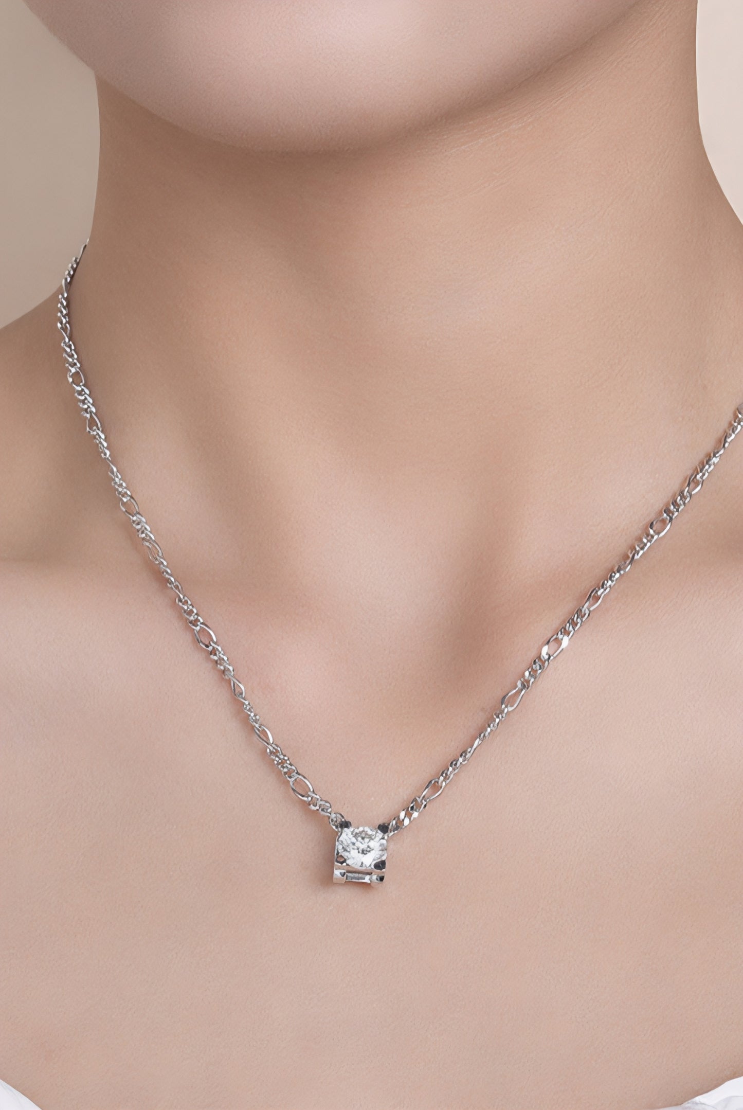Close up of a women wearing 2 carat moissanite solitaire pendant necklace in platinum-plated 925 sterling silver