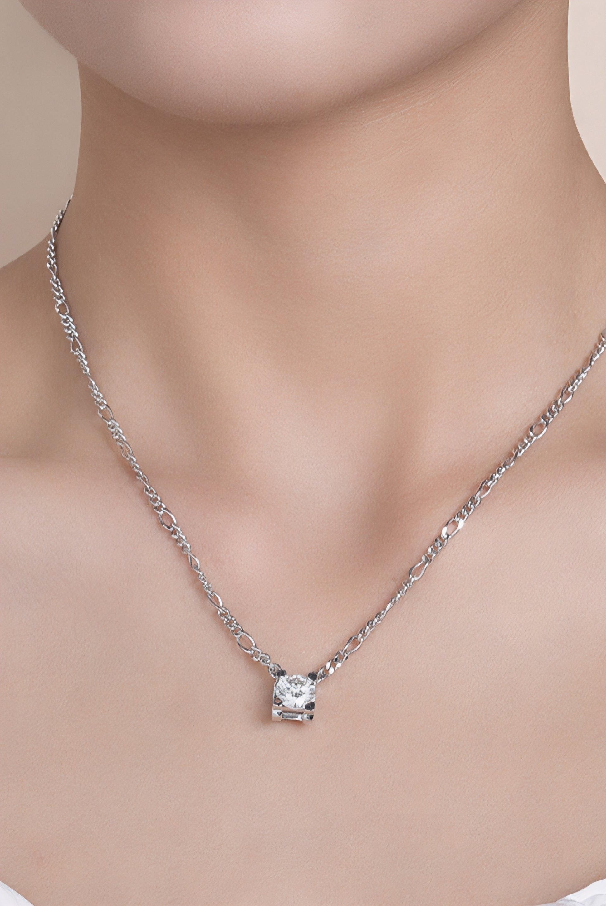 Close up of a women wearing 2 carat moissanite solitaire pendant necklace in platinum-plated 925 sterling silver