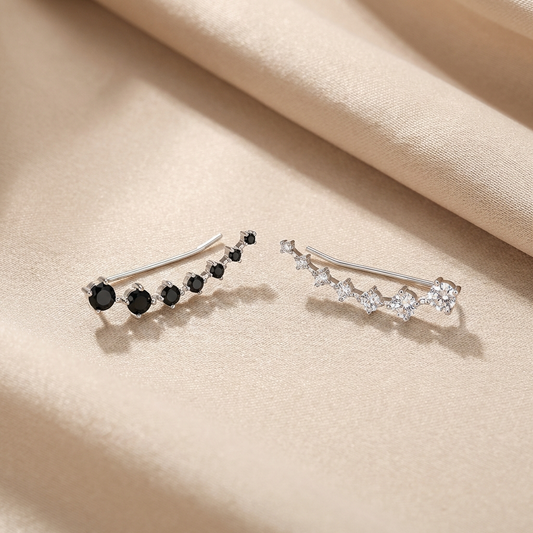 Platinum-plated sterling silver 1.9 carat moissanite ear climber earrings by MerchLuxx with round brilliant stones.