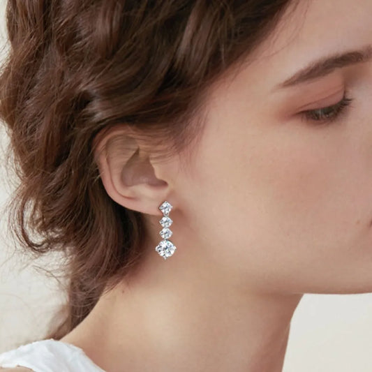 Celestia™ Moissanite Drop Earrings worn by woman