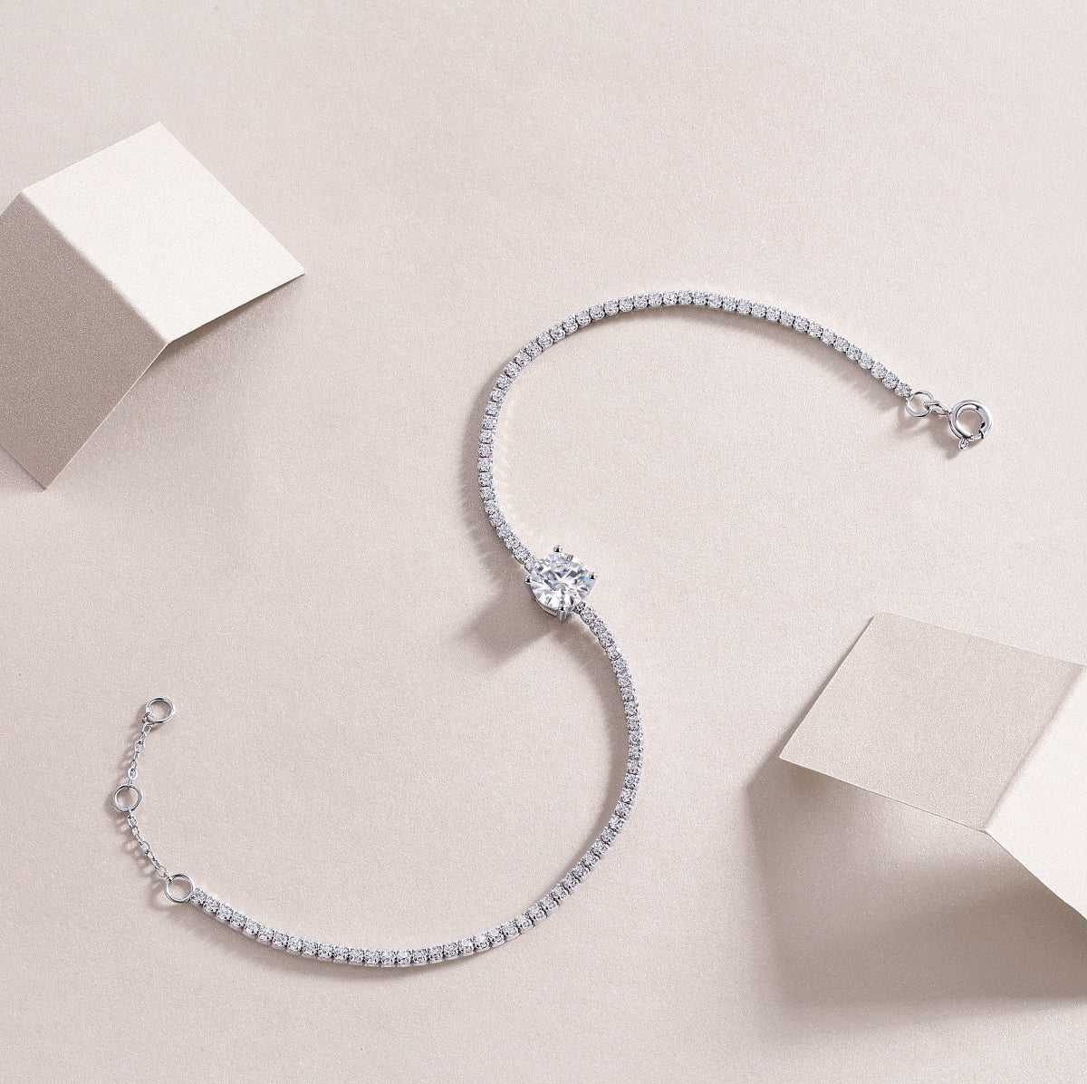 Écloria 1 carat moissanite tennis bracelet in S925 sterling silver, delicate luxury wrist jewelry by MerchLuxx on a light beige background