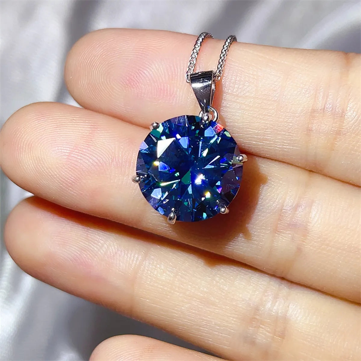 Astrielle 10-carat blue moissanite ring and pendant necklace set in sterling silver by MerchLuxx