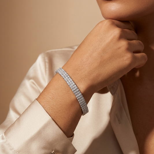 Imperielle multi-row moissanite tennis bracelet in S925 sterling silver, wide statement wrist jewelry by MerchLuxx on a wrist with a neutral background