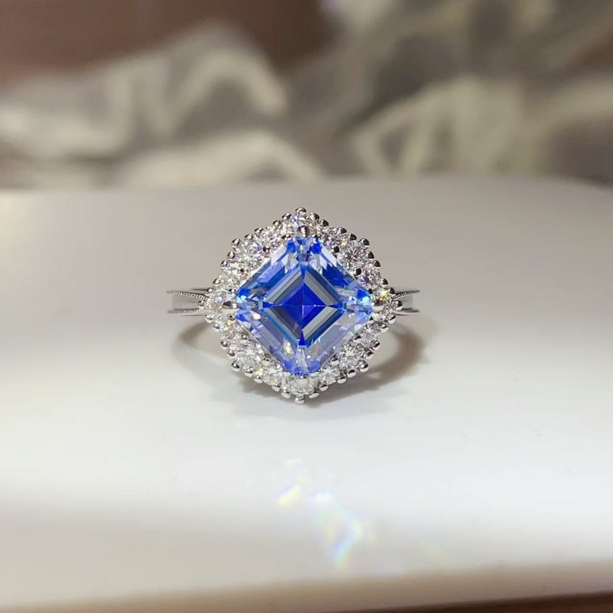 Sapphire™ Blue Halo Ring with a 3-carat blue moissanite in platinum-plated 925 sterling silver