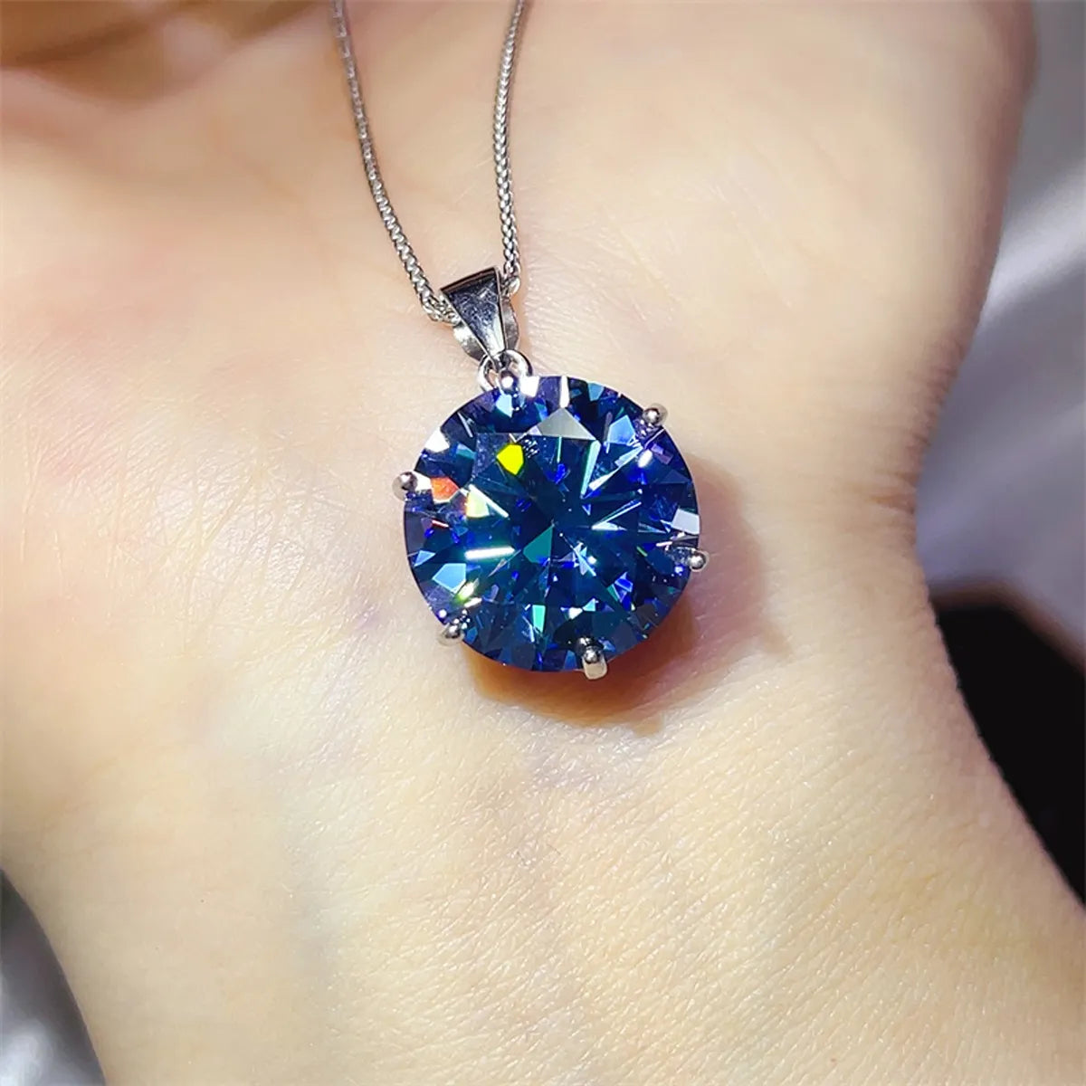 Astrielle 10-carat blue moissanite ring and pendant necklace set in sterling silver by MerchLuxx