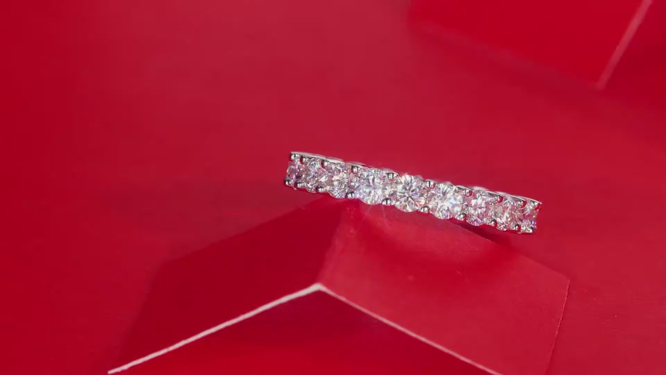 a video showing the sparkle of the Eternaé moissanite full eternity band in S925 sterling silver continuous round stone ring by MerchLuxx