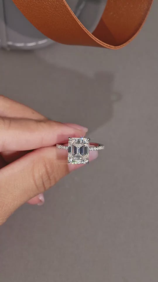 a video for the Luminara 9x11mm octagonal moissanite engagement ring in platinum-plated sterling silver cathedral setting by MerchLuxx
