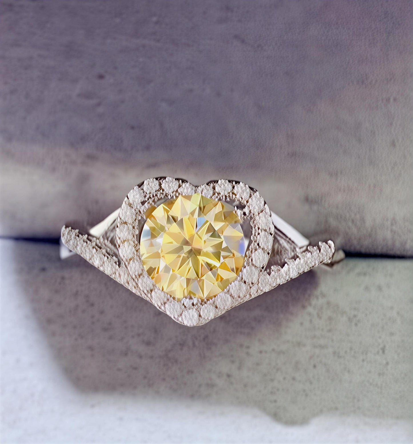  1-carat heart moissanite halo ring in platinum-plated sterling silver available in green, yellow, and white  on a textured surface