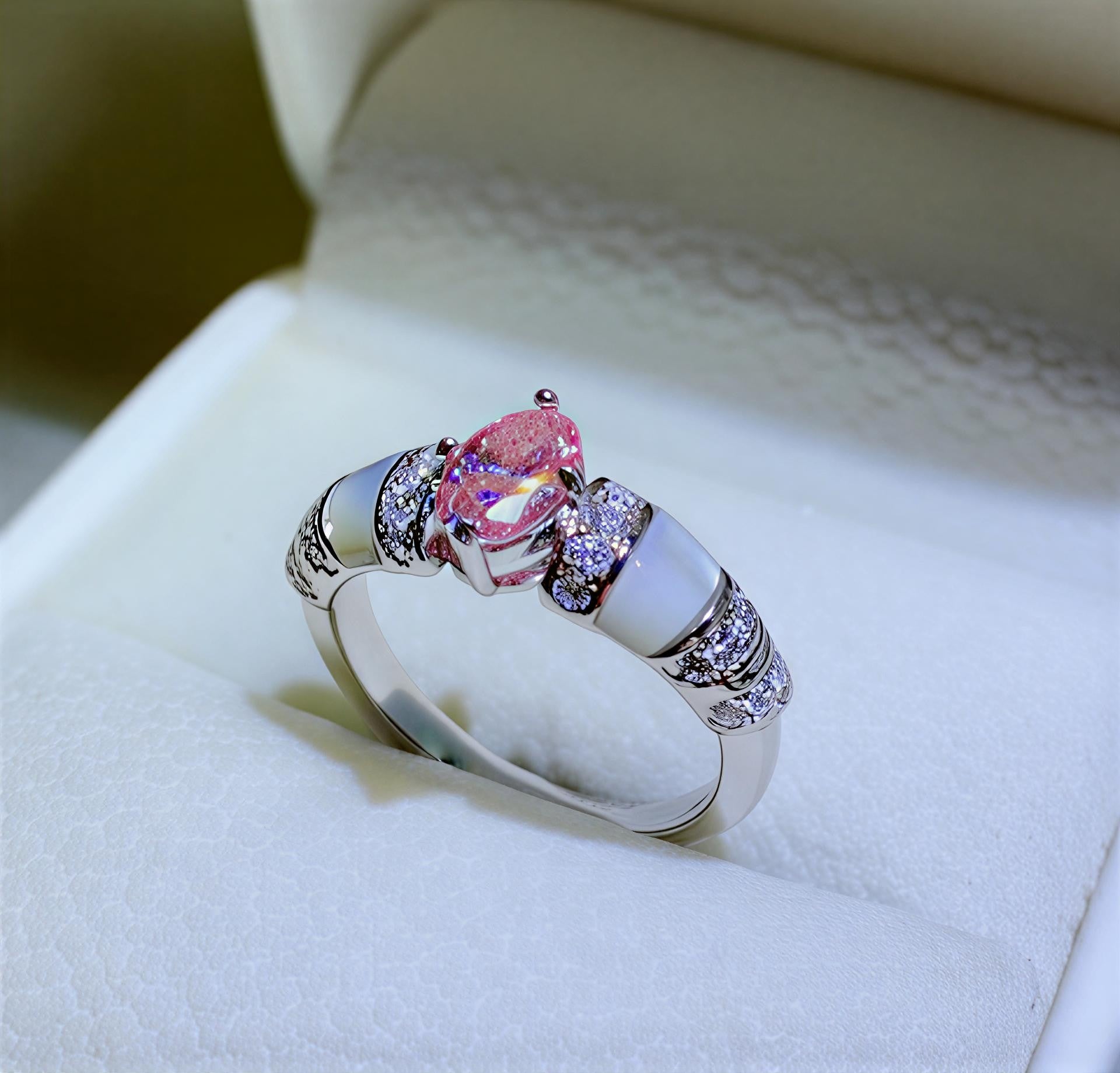 Veloria 1-carat pink and blue moissanite accent ring in platinum-plated sterling silver by MerchLuxx in a white jewelry box